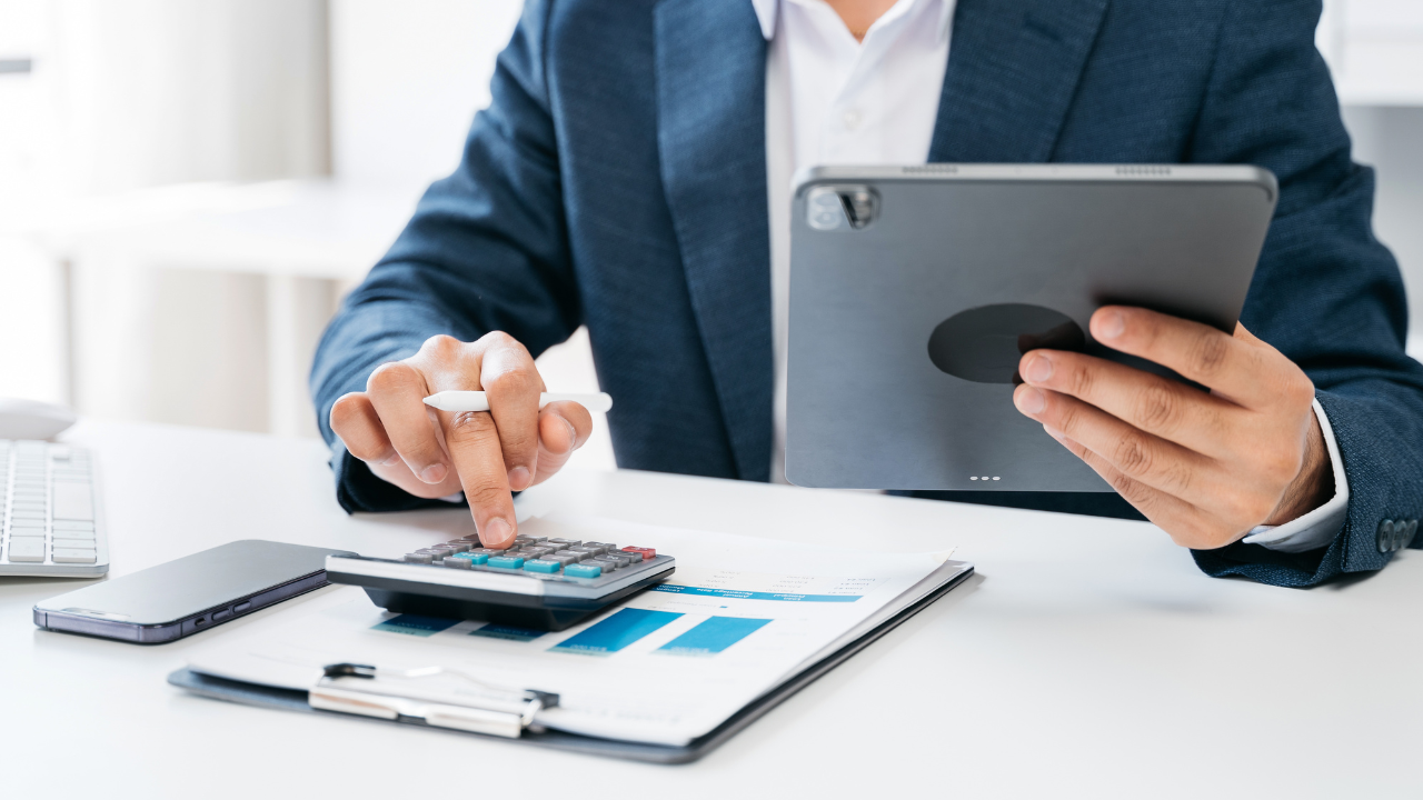 Man using calculator